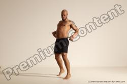 Underwear Gymnastic poses Man Black Muscular Bald Dancing Dynamic poses Academic